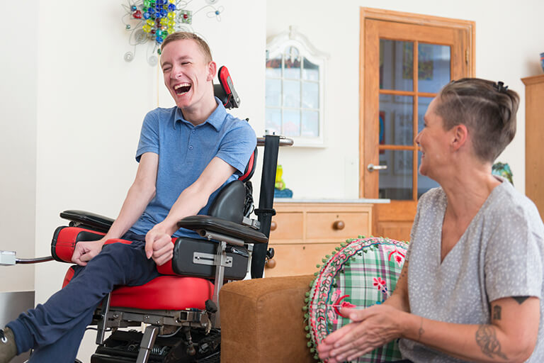 Youth with mobility device with mother