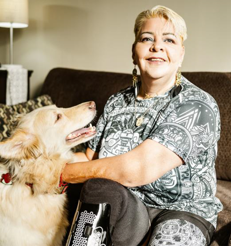woman sitting at home with dog