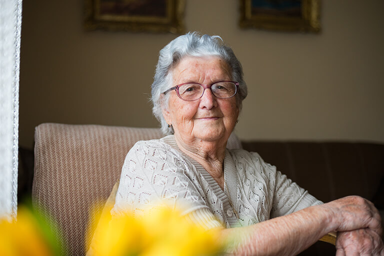 Senior woman holding cane