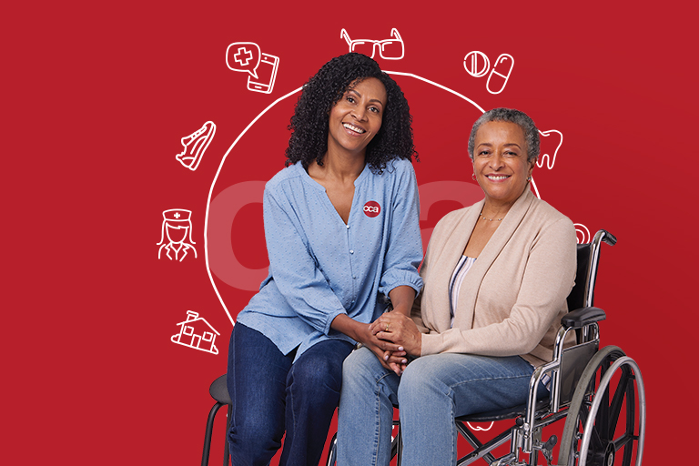 CCA caretaker and woman in wheelchair smiling