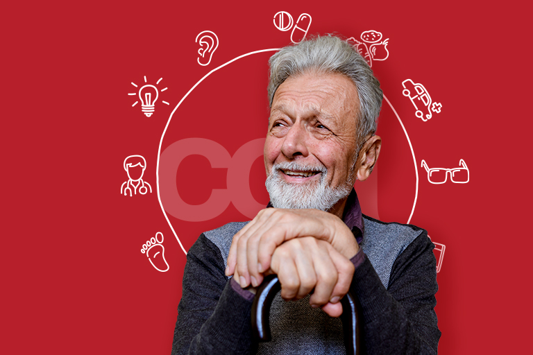 Man with cane sitting and smiling