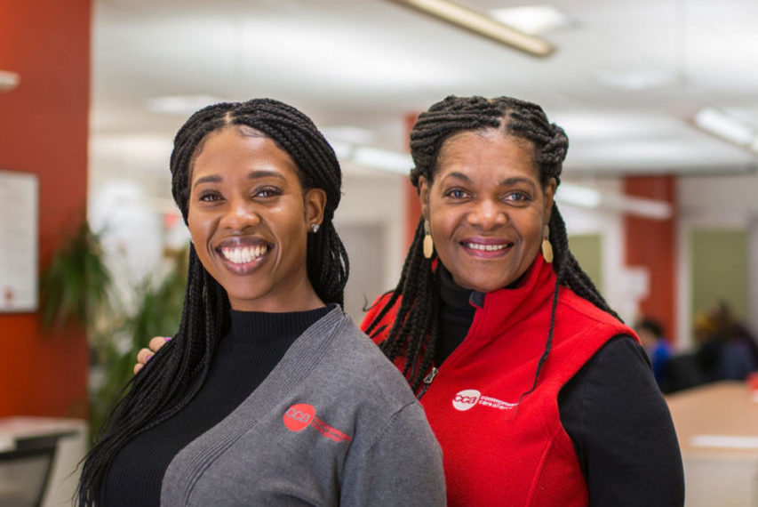 Two welcoming Commonwealth Care Alliance female medical professionals smiling