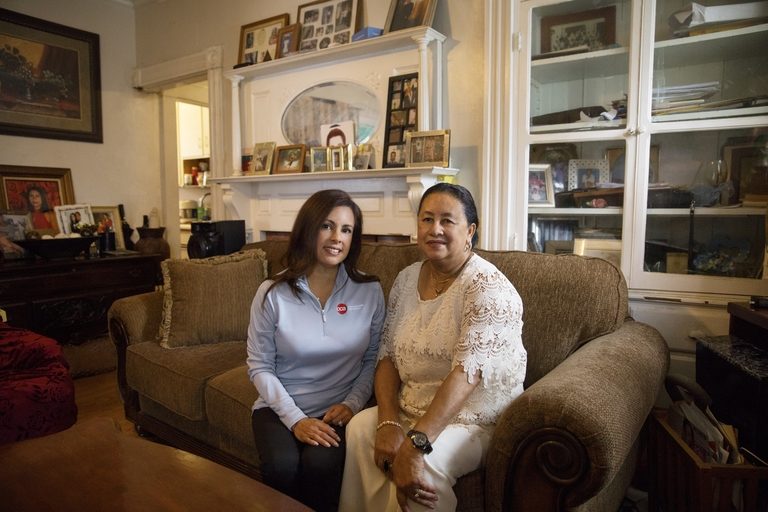 CCA SCO member seated on couch next to her care partner