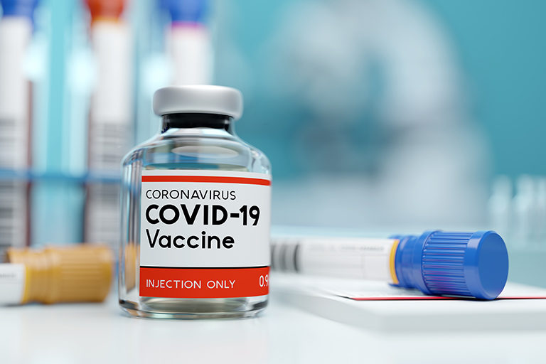 A single bottle vial of Covid-19 coronavirus vaccine in a research medical lab.