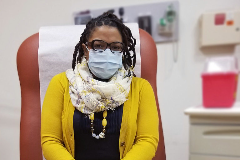 Daphney Balan Small, VP of Care Integrity at CCA waiting to get her COVID-19 vaccine