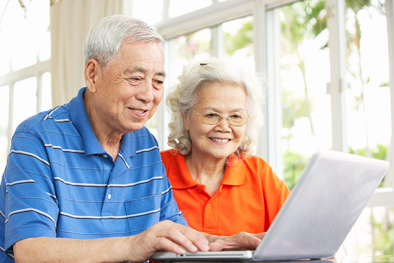 Older married couple using a laptop
