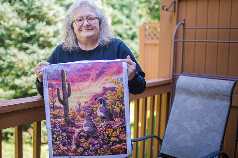 CCA member Judy holding her diamond art