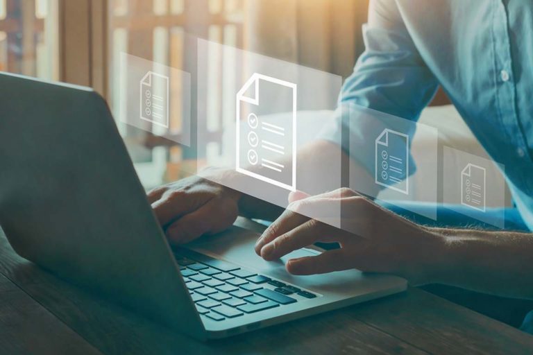 Effective August 1, 2022: Payment Policy Updates Health care provider accessing information on a computer