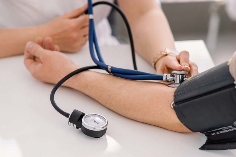 Health care professional checking a patient's blood pressure
