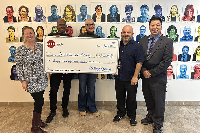 CCA Health California Invests in Local Partners to Combat Food Insecurity and Loneliness Among Seniors CCA presenting a large check to the Institute on Aging