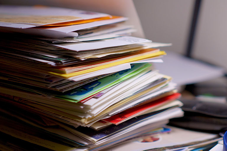 Large stack of financial bills, letters, cards