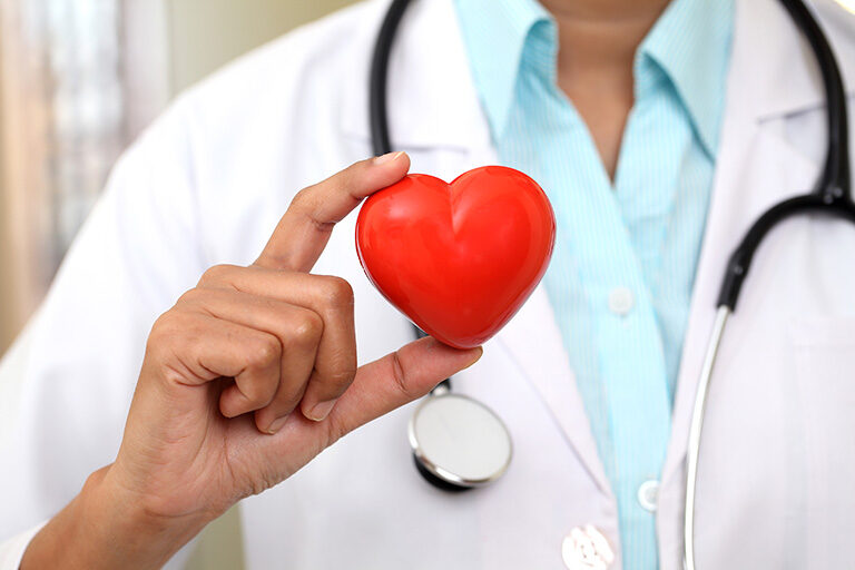 Decorative image of doctor holding plastic heart