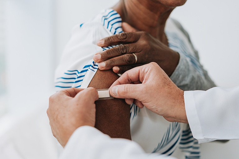 an older adult getting a flu shot