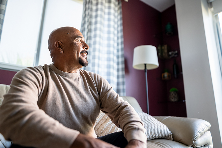 Man sitting in his living room.